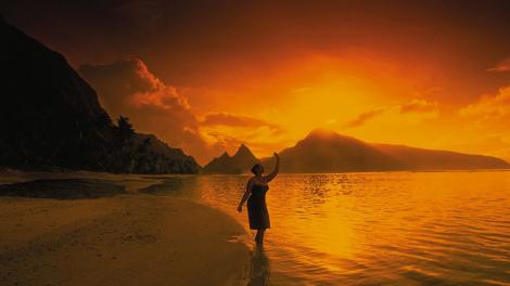 Rising sun over the mountains and coastline of the Manu'a Islands