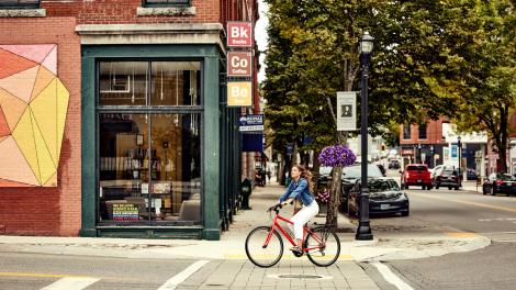 Bike rider seeing the sights in small-town Biddeford, Maine