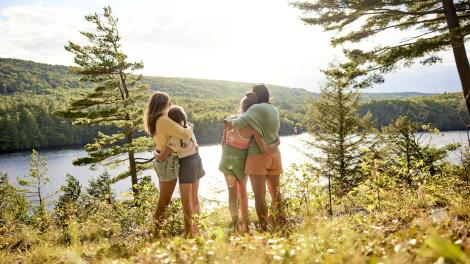 Travelers basking in the natural beauty of The Forks in Maine