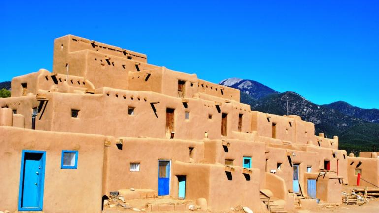 Explore the ancient adobe buildings of the Taos Pueblo.