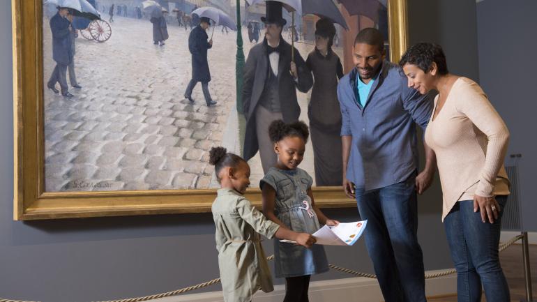 A family exploring the galleries at the Art Institute of Chicago A family exploring the galleries at the Art Institute of Chicago