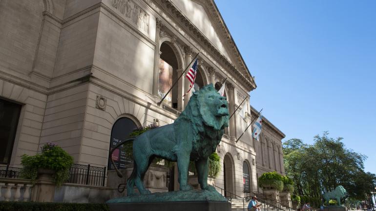 Regal lion statues flanking the Michigan Avenue Entrance Regal lion statues flanking the Michigan Avenue Entrance