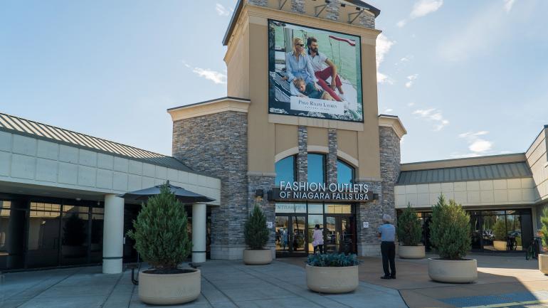 Shoppers at the entrance to the Fashion Outlets of Niagara Falls