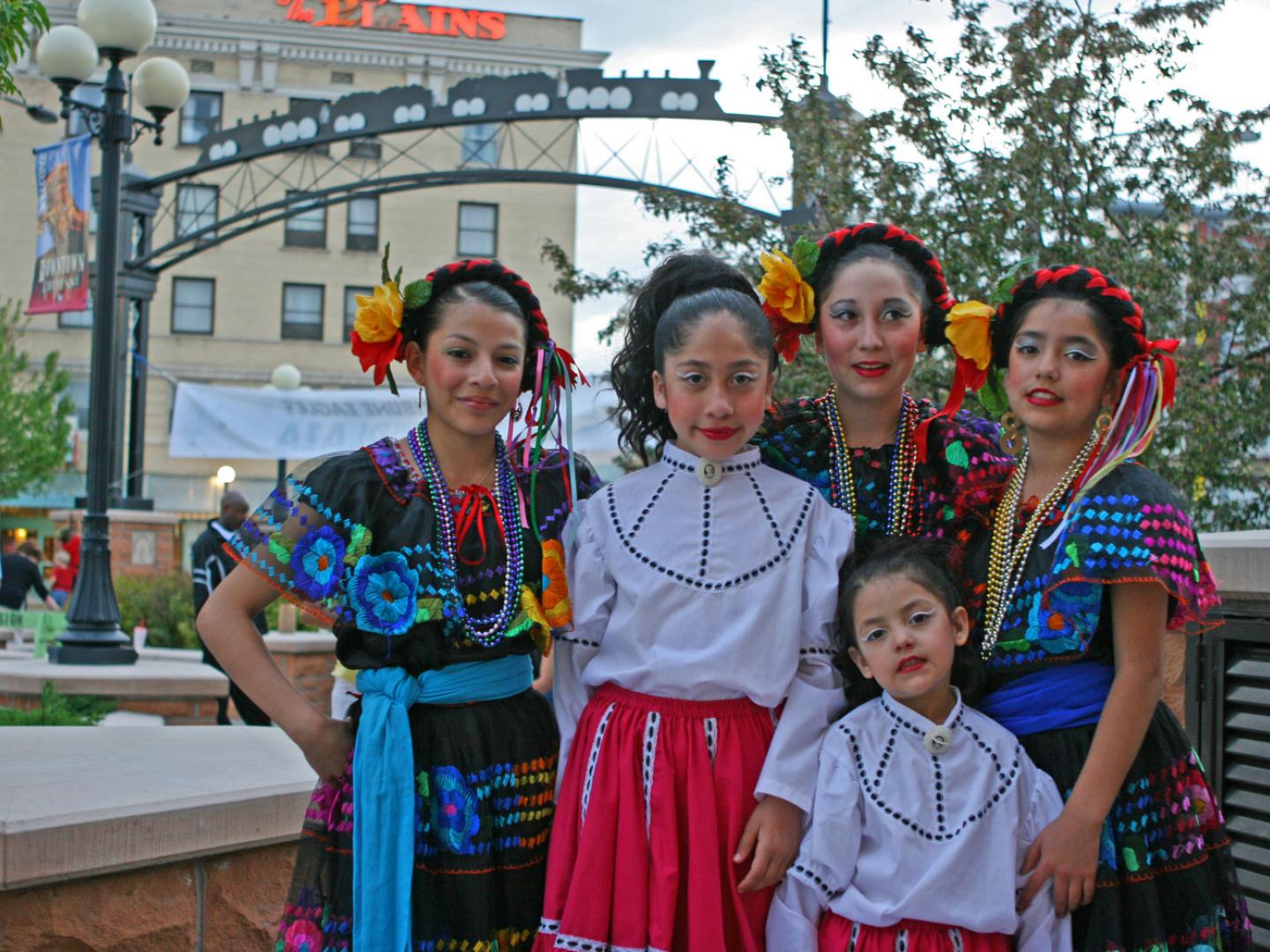 Dancers dressed in traditional garb for Cheyenne’s Hispanic festival