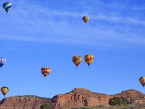 Hot air balloons soaring over the red rock Vermilion Cliffs Hot air balloons soaring over the red rock Vermilion Cliffs