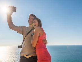 Couple taking a selfie in front of Lake Michigan Couple taking a selfie in front of Lake Michigan