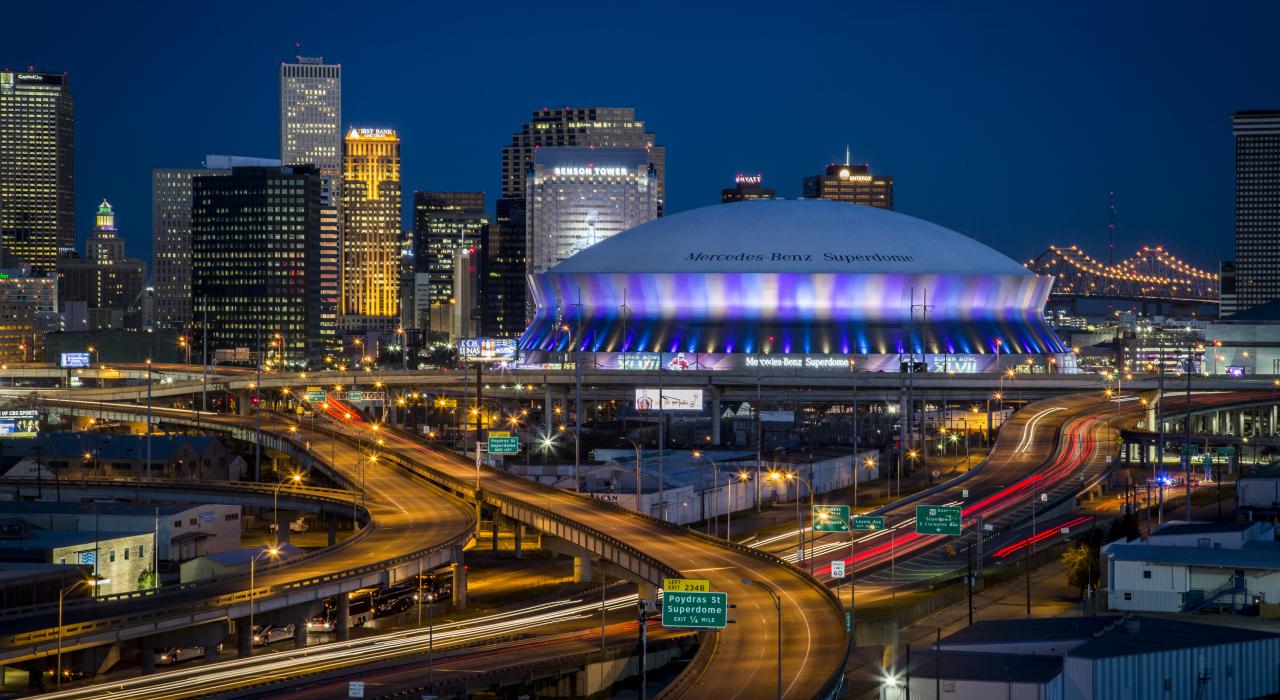 The Mercedes-Benz Superdome arena, gleaming in the night sky of New Orleans, Louisiana