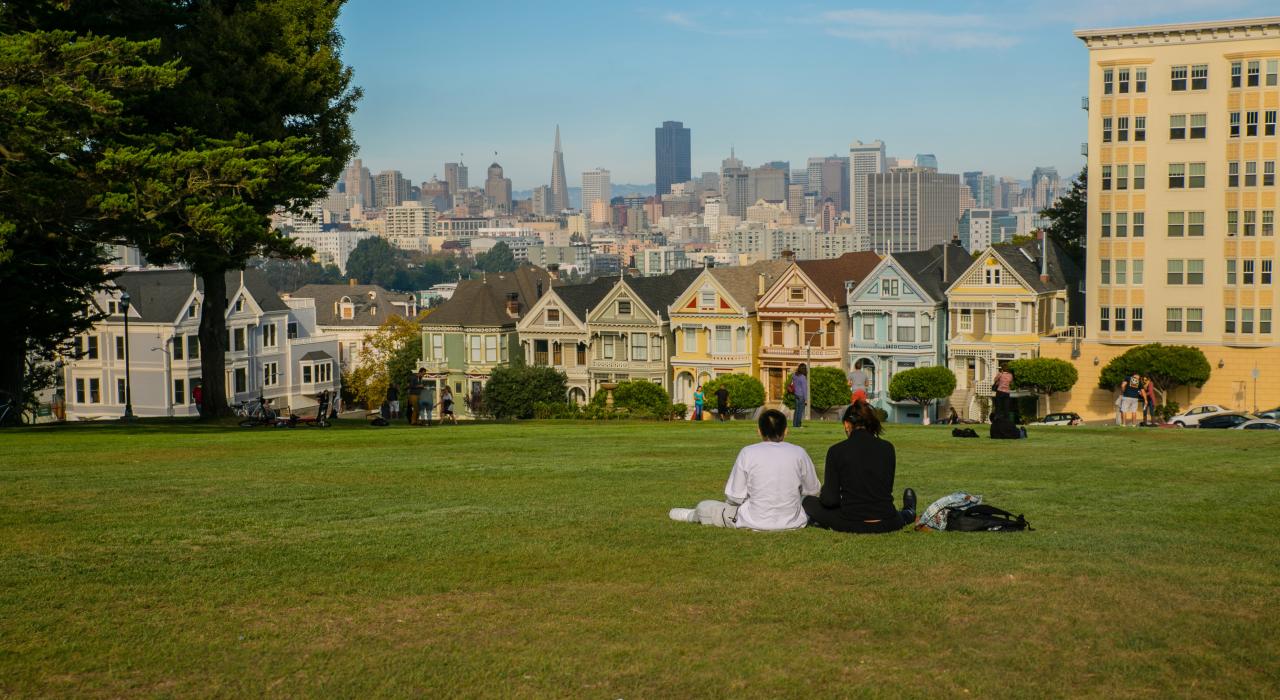 Alamo Square with ‘Painted Lady’ houses and views of San Francisco, California