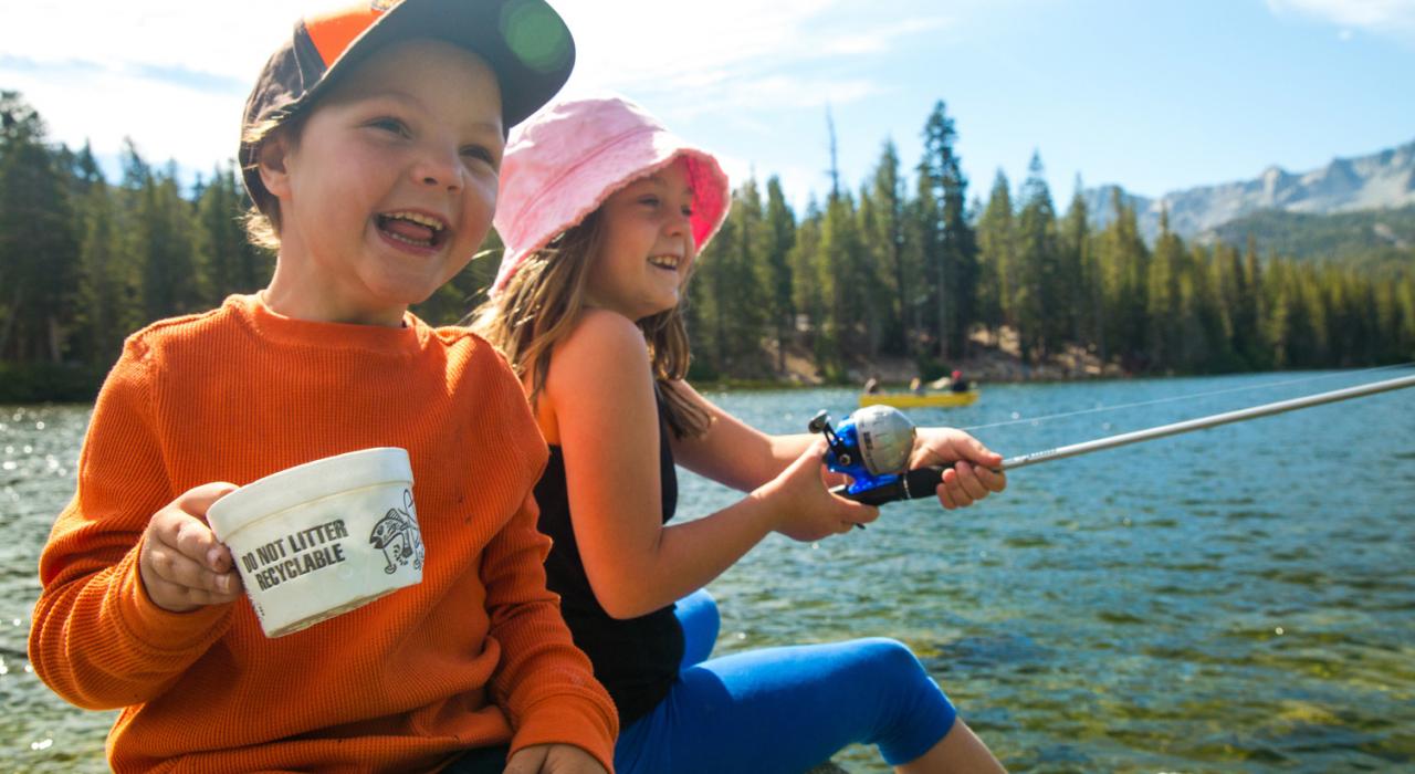 Kids fish from a cozy, rocky spot on beautiful Mammoth Lake