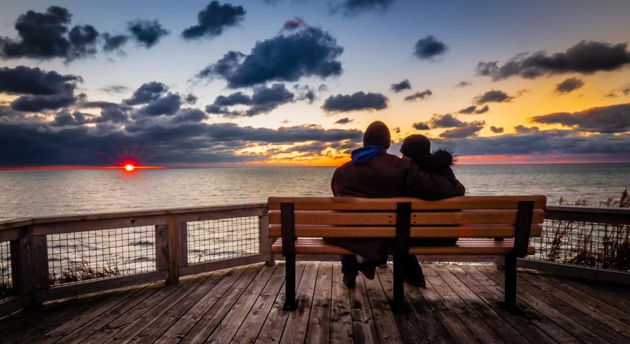 Couple watching a Lake Michigan sunset from Tunnel Park