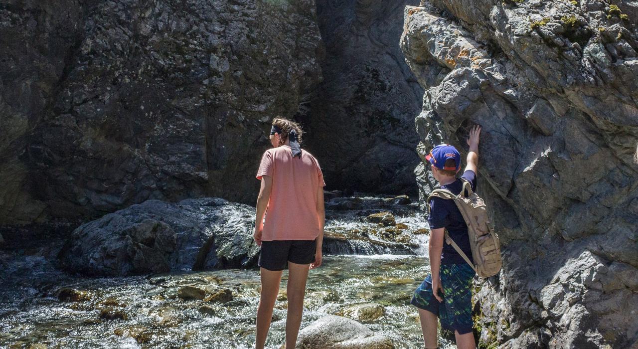 Wading in the cool waters at the base of Zapata Falls